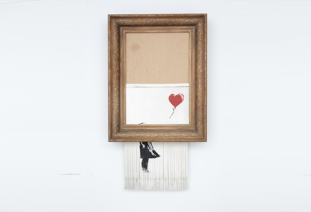 L'ultima performance di Banksy: l'opera si autodistrugge in asta dopo la vendita L'ultima performance di Banksy: l'opera si autodistrugge in asta dopo la vendita