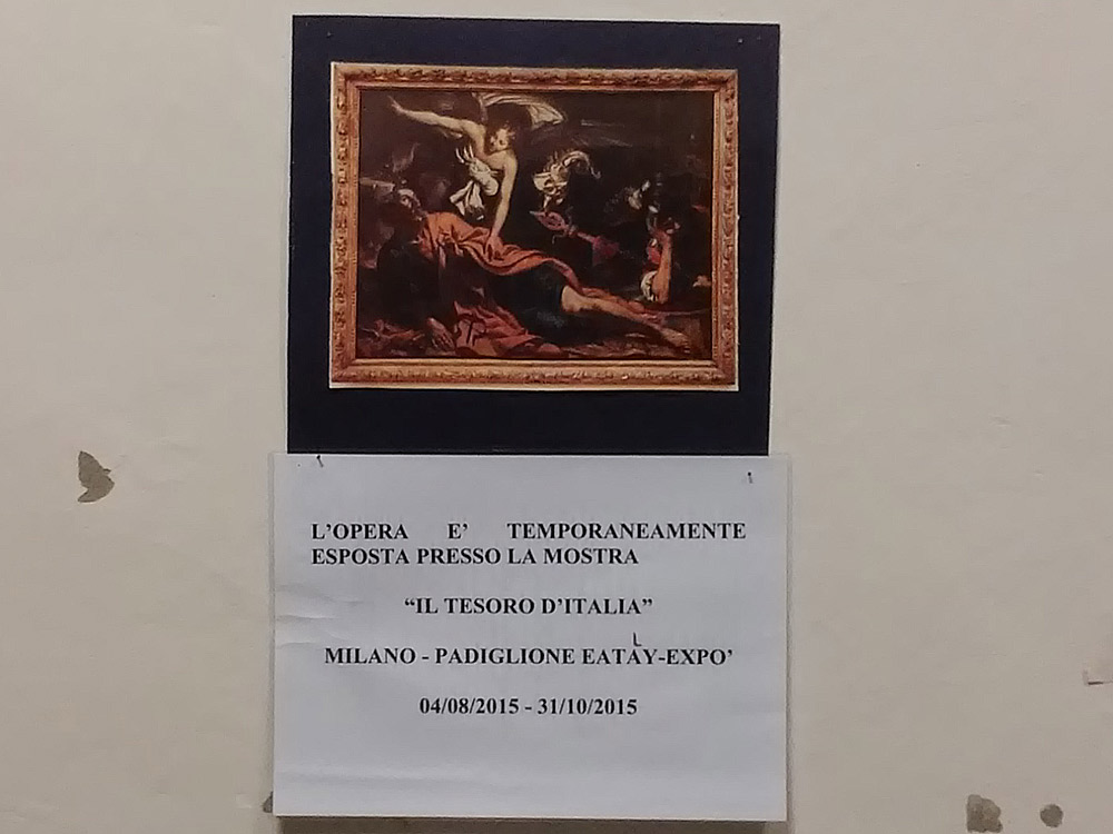 Un cartello indica l'assenza del San Pietro in carcere di Giovanni Francesco Guerrieri dalla sua parete alla Galleria Nazionale delle Marche di Urbino, nel 2015: era stata prestata per la mostra di Sgarbi e Eataly all'Expo di Milano
