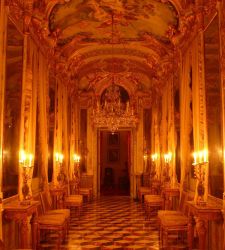 Palazzo Spinola's Mirror Gallery is lit up by candlelight today