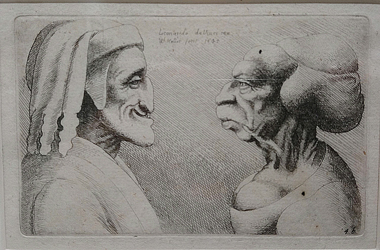 Wenceslaus Hollar, Due teste grottesche affronate, una femminile e una maschile con copricapo che ricorda quello indossato da Dante (1645; acquaforte, 69 x 112 mm l'incisione, 71 x 114 mm l'impronta, 80 x 121 mm la finestra di montaggio; Lamporecchio, Fondazione Rossana & Carlo Pedretti, FRCP_S_H.024). Iscrizioni: Al centro in alto: « Leonardo da Vinci inv: | W. Hollar fecit 1645 ». In basso a dx: « 4b ». P1594

