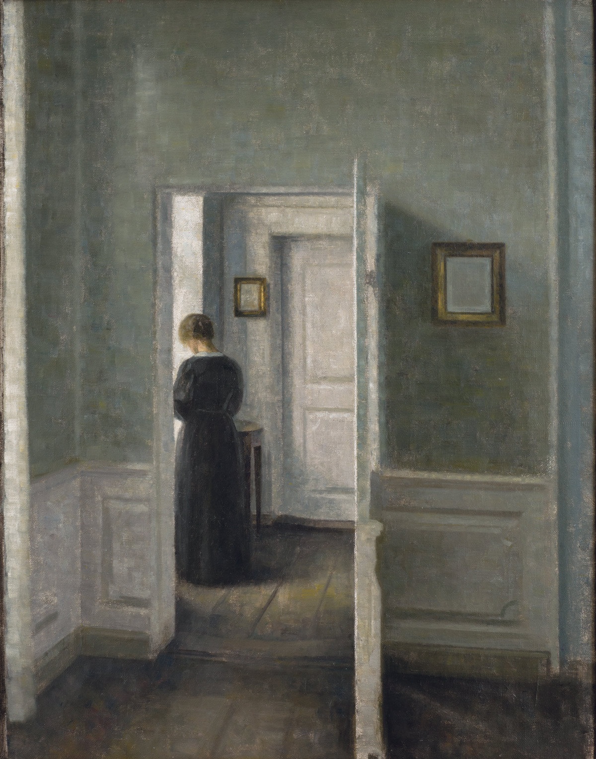 Vilhelm Hammershøi, Interno con donna in piedi (s.d.; olio su tela, 67,5 x 54,3 cm; Ambassador John L. Loeb Jr. Danish Art Collection)
