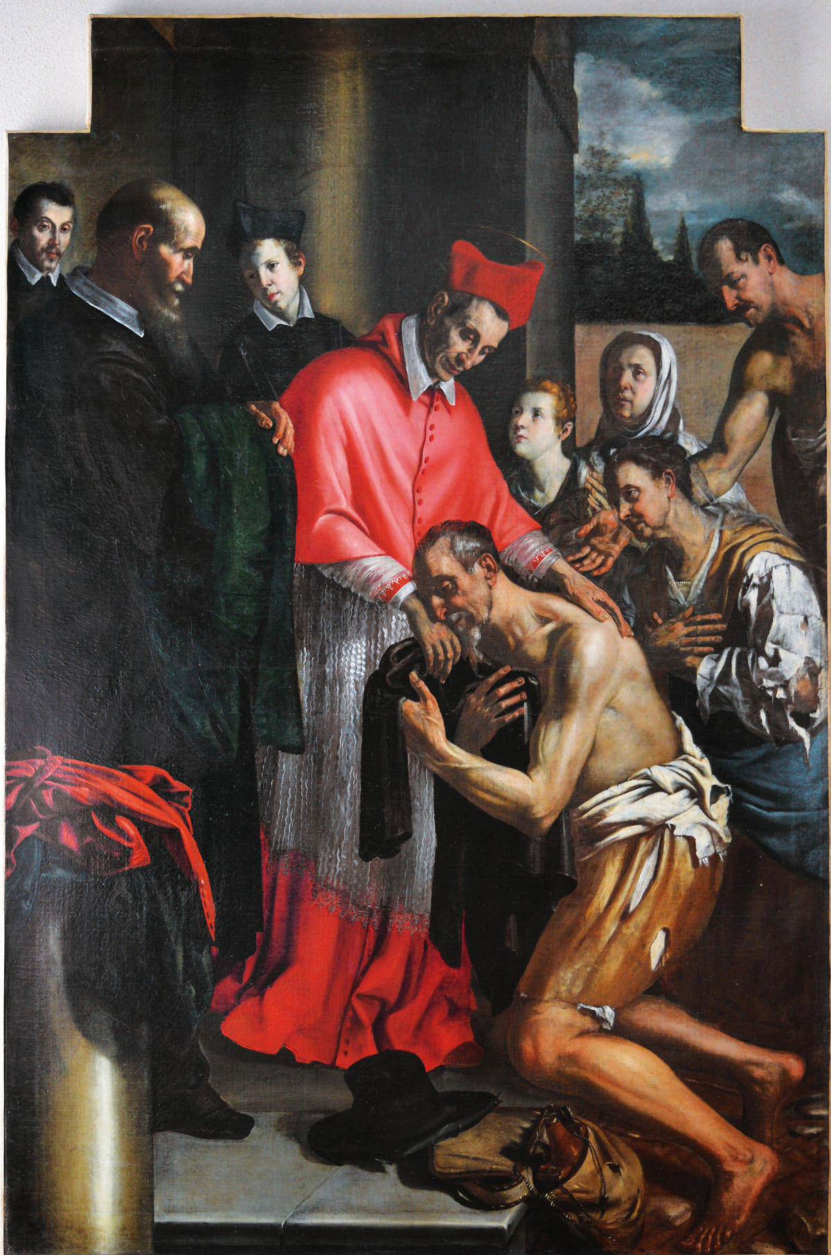 Giovanni Francesco Guerrieri, San Carlo Borromeo riceve l’omaggio dei coniugi Petrucci in abiti da mendicanti (seconda metà del terzo decennio del Seicento; olio su tela, 214 x 145 cm; Fano, chiesa di San Pietro in Valle, in deposito presso la Pinacoteca civica)
