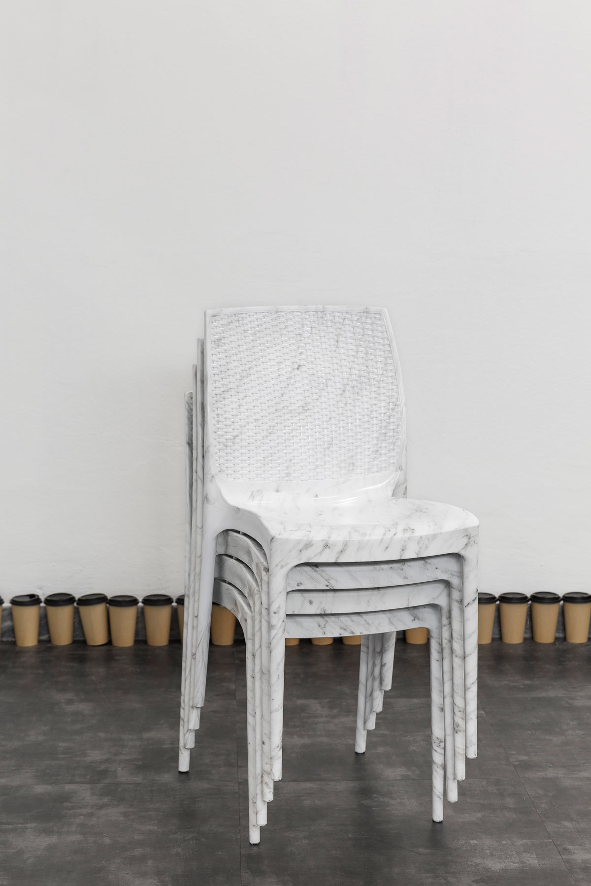 Débora Delmar, Exclusive Providers (White Marble Stacked Chairs) (2019; idrostampa su polipropilene, 102 x 54 x 44 cm). Courtesy GALLLERIAPIU and the artist. Photo: Stefano Maniero
