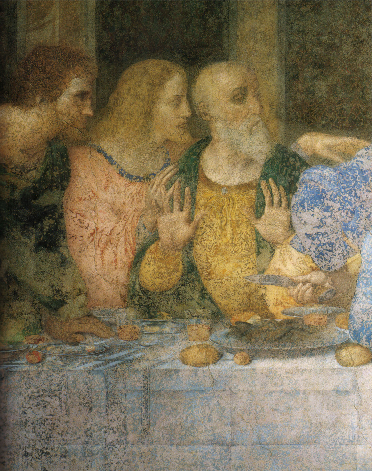 Leonardo. Il Cenacolo. Gli Apostoli Bartolomeo, Giacomo di Alfeo, e Andrea. Volti e mani parlano, rivelando l'inquietudine dei cuori e delle menti.
