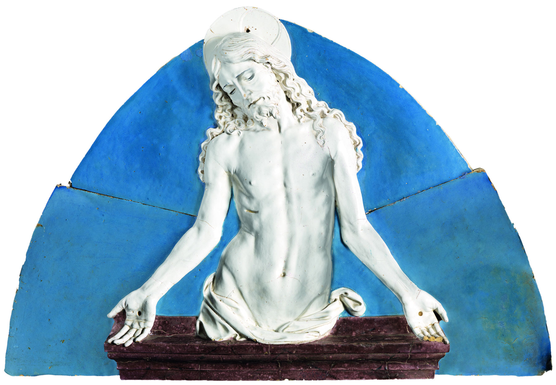 Andrea della Robbia, Cristo in pietà (1495 circa; terracotta invetriata, 70 x 105 cm; Firenze, Fondazione Cassa di Risparmio)
