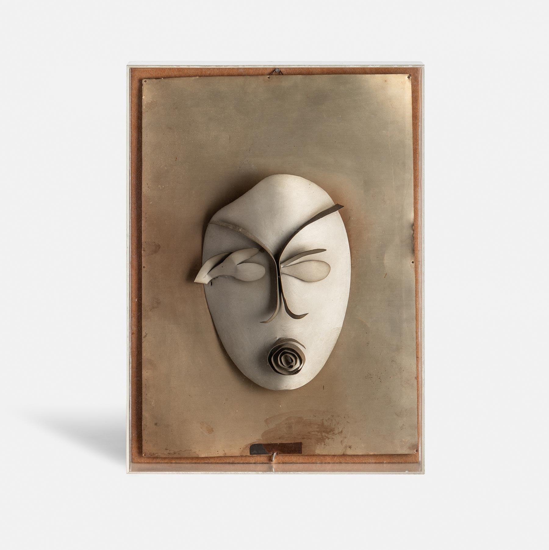 Regina, Maschera (La donna e il fiore) (1930-34; alluminio, 45 x 33 x 7 cm; Collezione Archivio Gaetano e Zoe Fermani) Foto: Alessandro Saletta e Piercarlo Quecchia - DSL Studio
