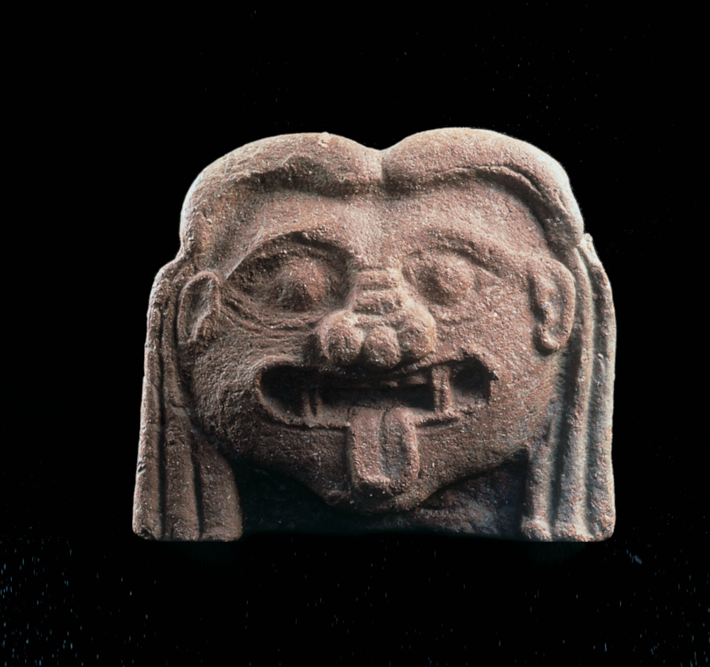 A Gorgon-head antefix from the Murlo Archaeological Museum.