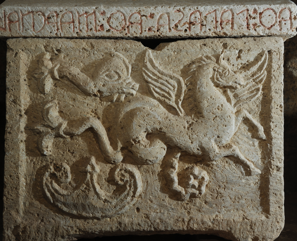 Chest carved with mythological scenes and winged monsters at the Chiusi Underground City Museum