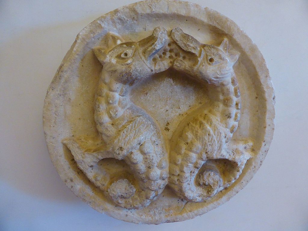 Romanesque art, Clipeus with two fantastic animals (11th-12th century; marble; Cividale del Friuli, National Archaeological Museum)