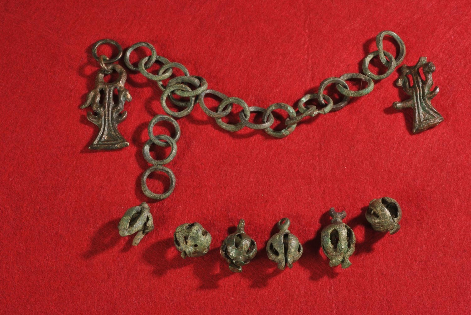 Ornithomorphic (bird-shaped) double protome pendant, with triangular termination, from tomb 5A, Chiavari, Corso Millo, Iron Age necropolis excavation (bronze, length 6 cm; Chiavari, National Archaeological Museum)