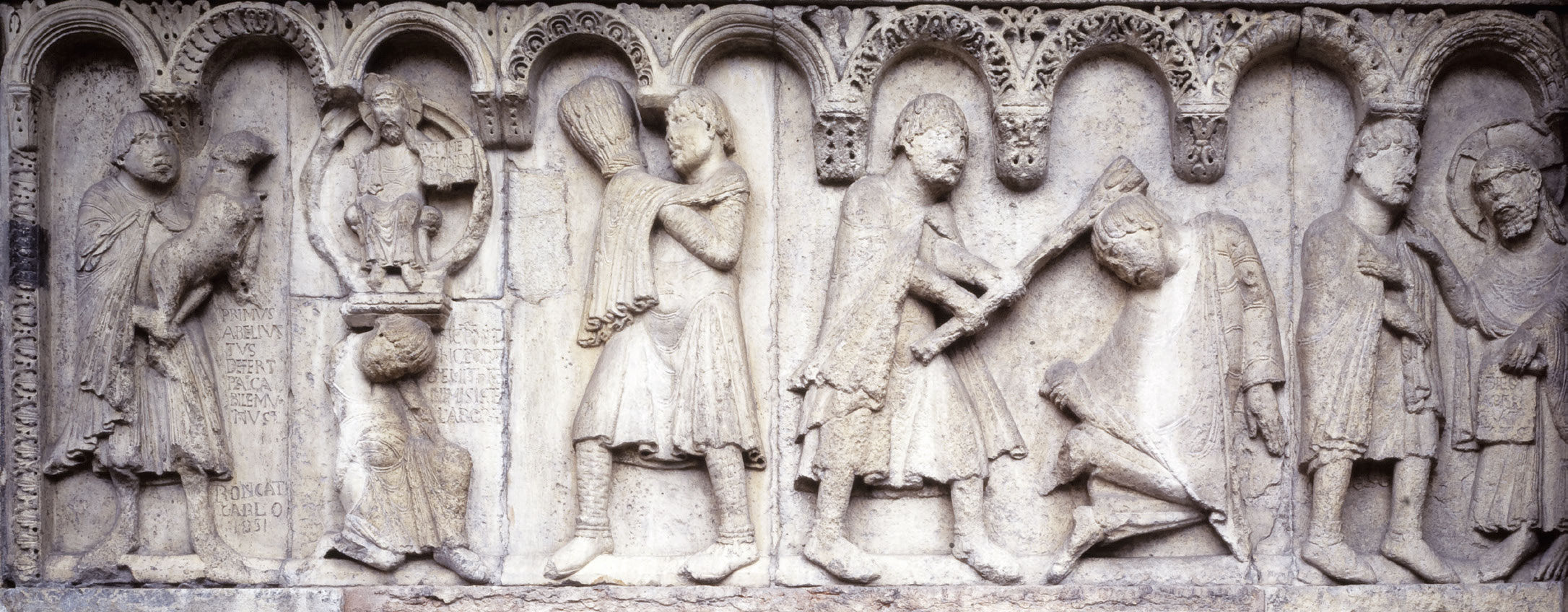Wiligelmo, Stories from Genesis: the sacrifices of Cain and Abel, the slaying of Abel, and the encounter between God and Cain (c. 1099-1110; Vicenza soft stone; Modena, Duomo). Photo: Museums of the Cathedral of Modena