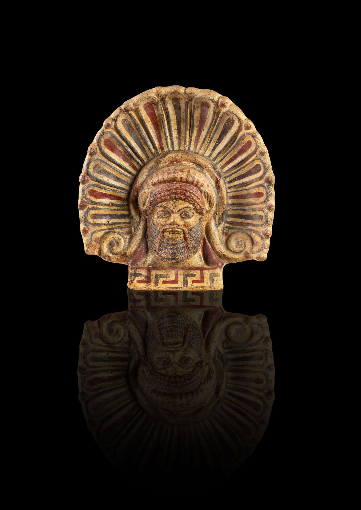Antefijo con cabeza de sátiro del siglo V a.C. Del santuario de Portonaccio en Veio.  Museo Nacional Etrusco de Villa Giulia.  Archivo fotográfico Mauro Benedetti