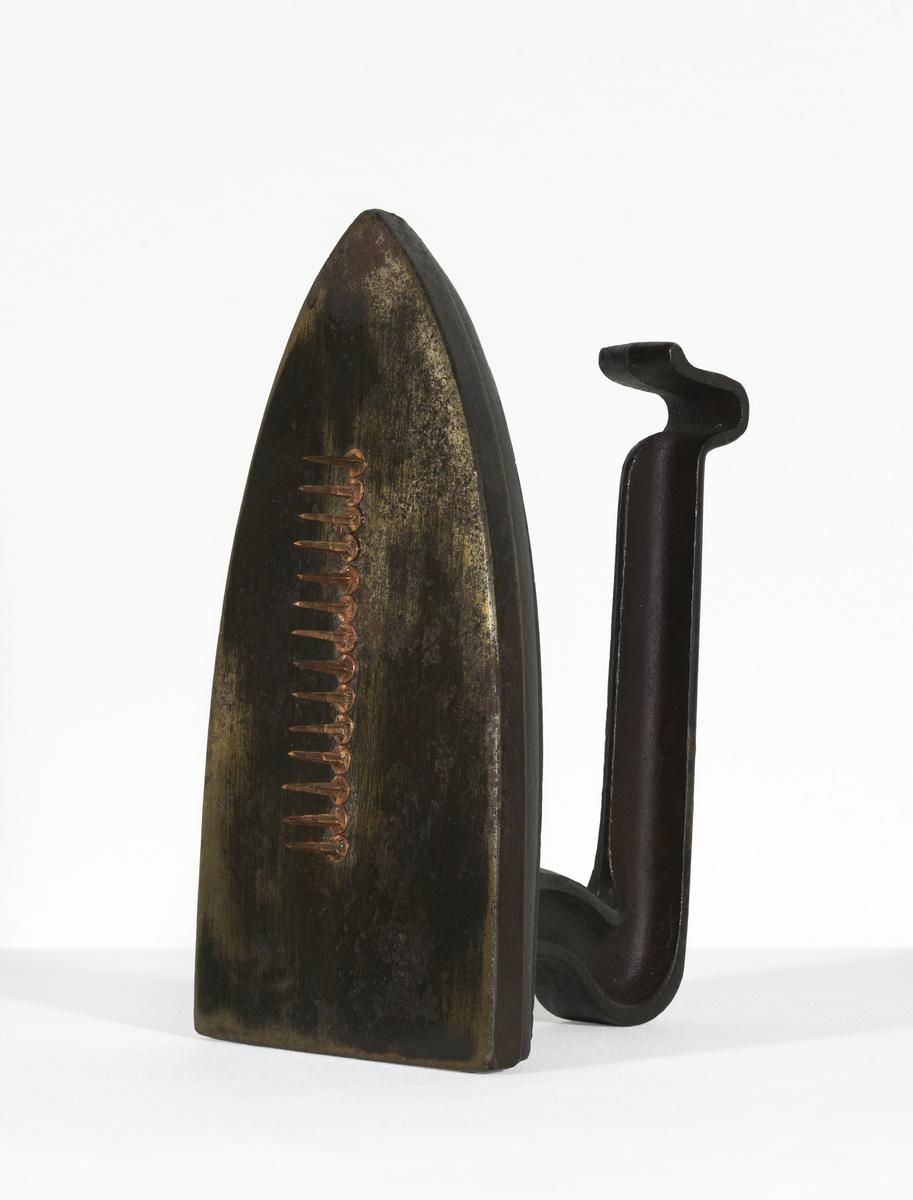 Man Ray, Cadeau (1921 [1972]; iron and nails, 17.8 x 9.4 x 12.6 cm; London, Tate Modern)